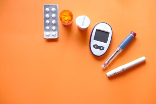 Diabetes monitoring equipment, including a glucose meter and insulin pen.