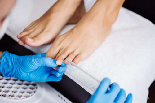 Foot care treatment being carried out by a healthcare professional.